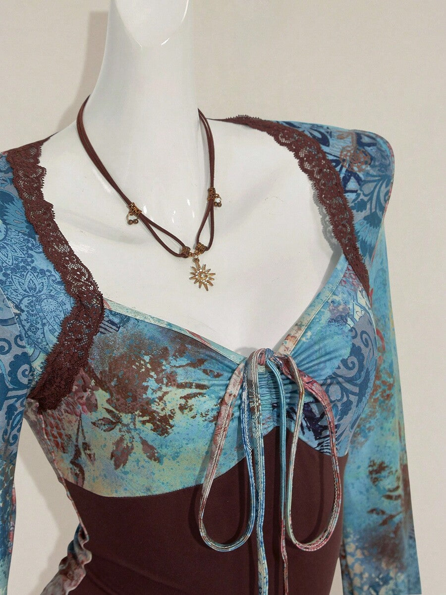 Women's vintage plant print top featuring a sweetheart neckline, flare long sleeves, contrast lace, knot detail, and ruched asymmetrical hem in multicolor.
