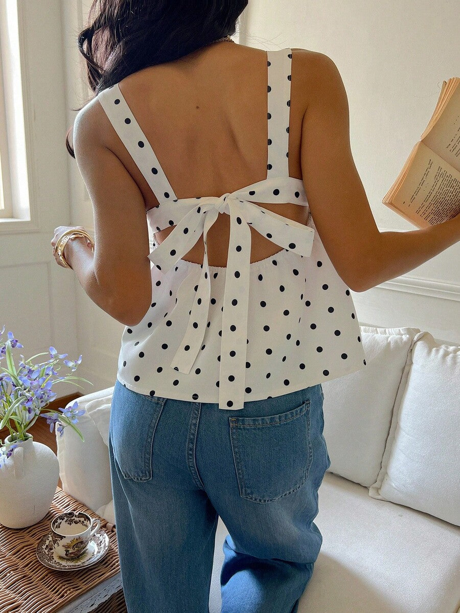 Women's casual polka dot tank top with tie-front knot, strap neckline, backless design, and ruffle flared hem
