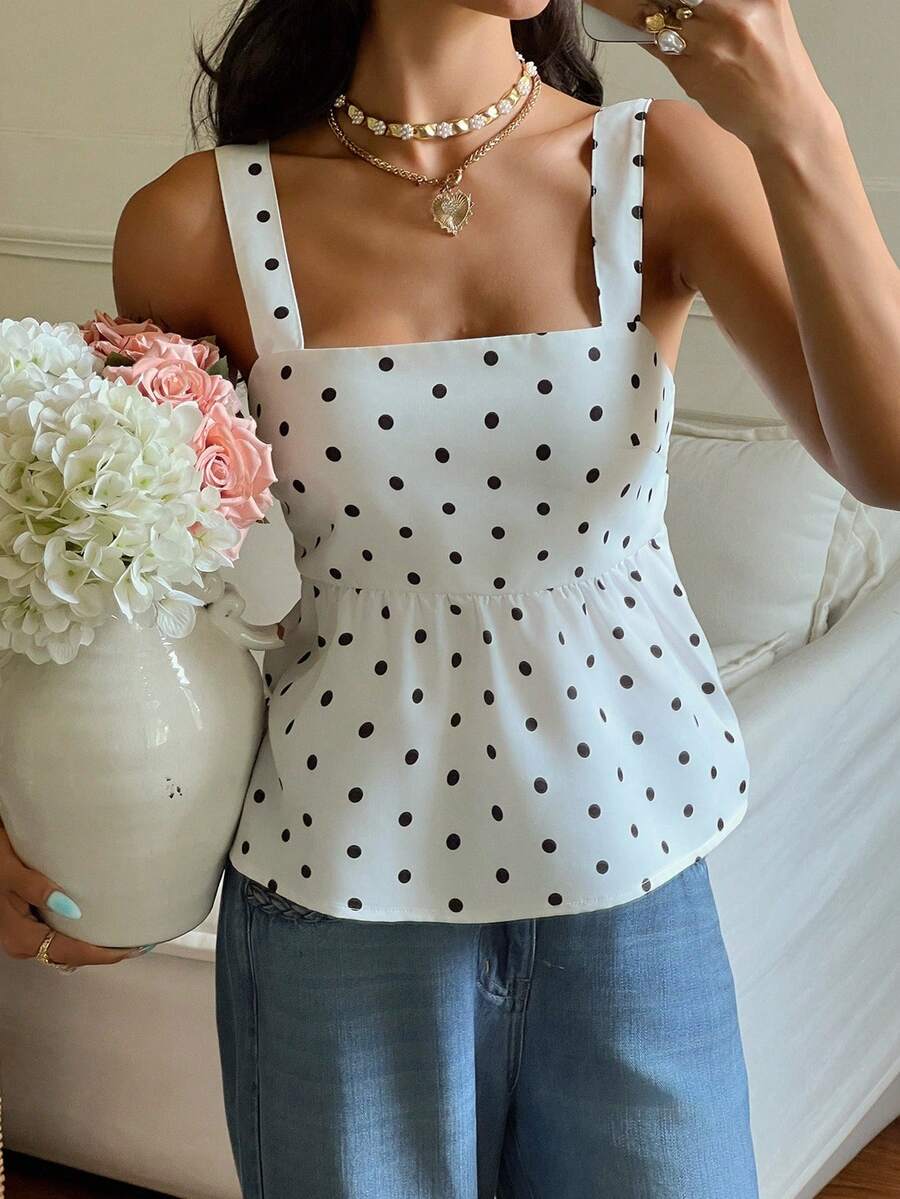 Women's casual polka dot tank top with tie-front knot, strap neckline, backless design, and ruffle flared hem