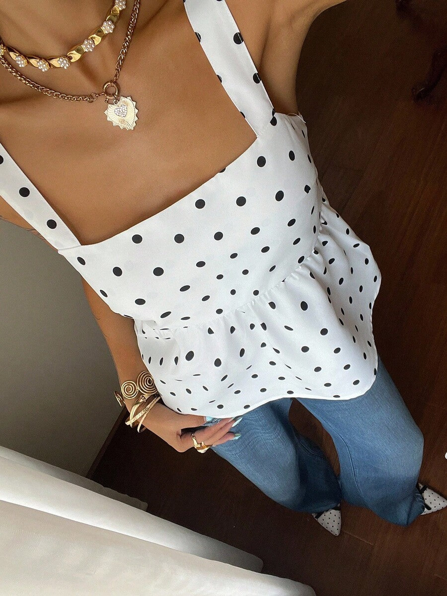 Women's casual polka dot tank top with tie-front knot, strap neckline, backless design, and ruffle flared hem
