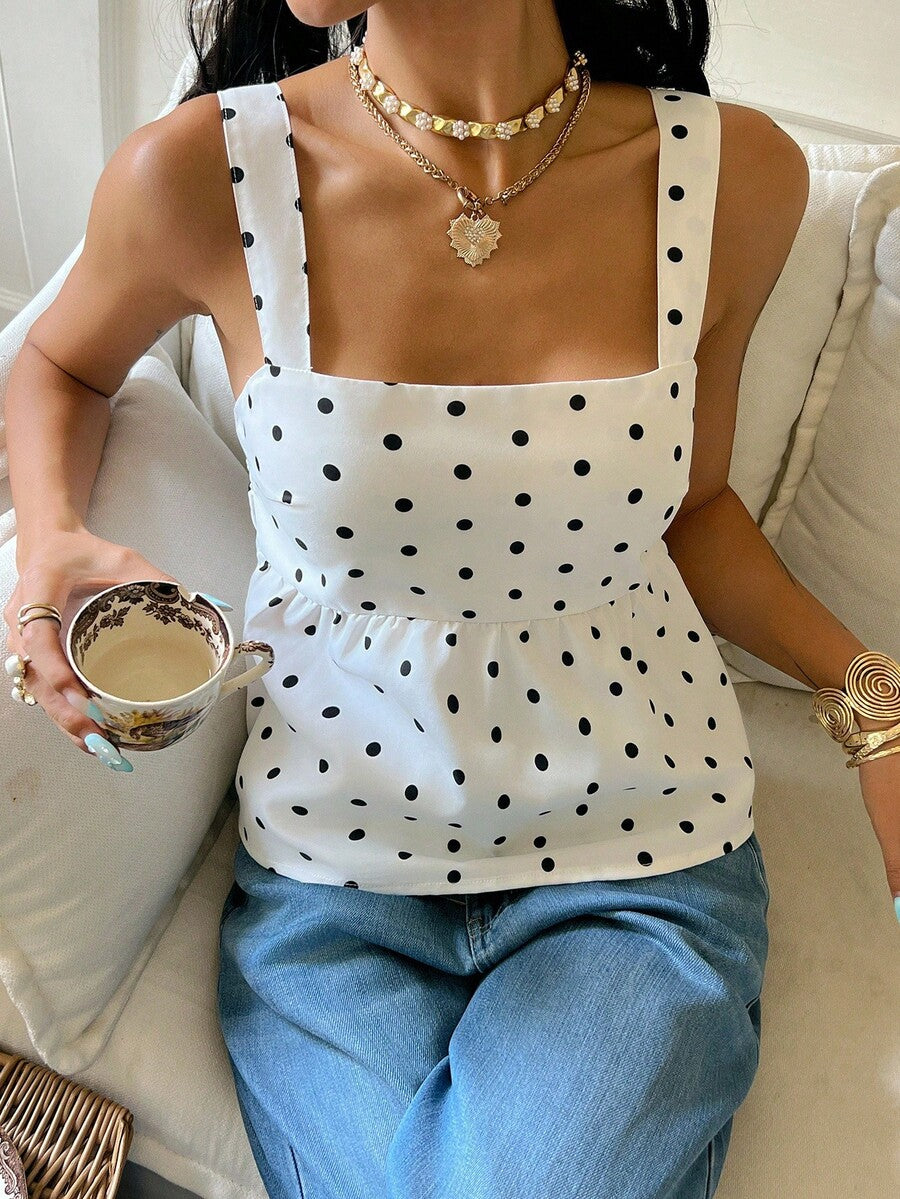 Women's casual polka dot tank top with tie-front knot, strap neckline, backless design, and ruffle flared hem