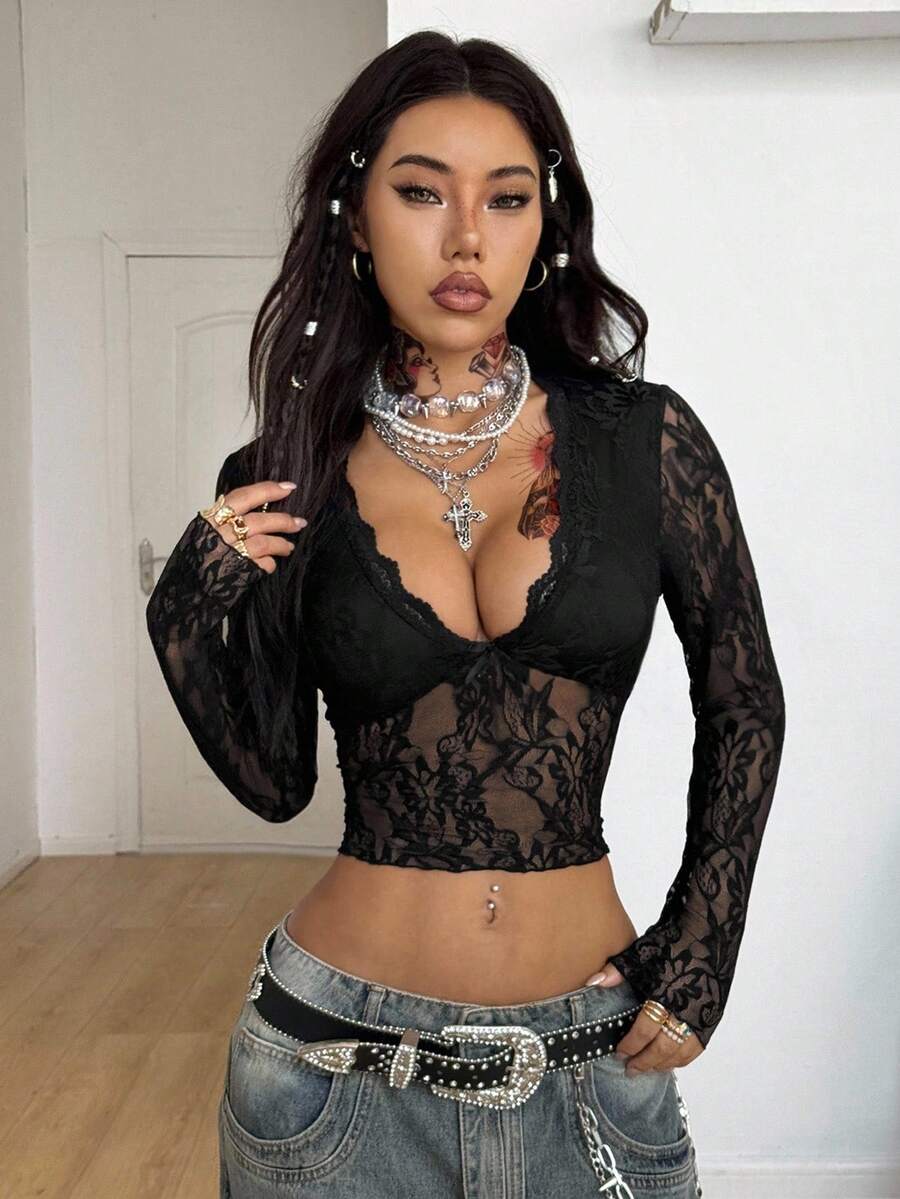 Women's polka dot sheer mesh crop blouse featuring contrast scallop lace trim along the V-neckline and long sleeves in a slim fit silhouette.