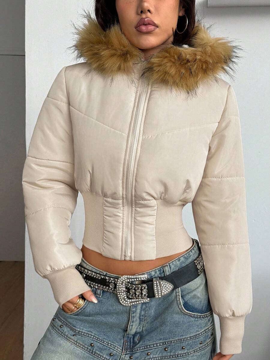 Apricot women's short quilted puffer jacket with hooded neckline, front zipper closure, and rib-knit cuffs.