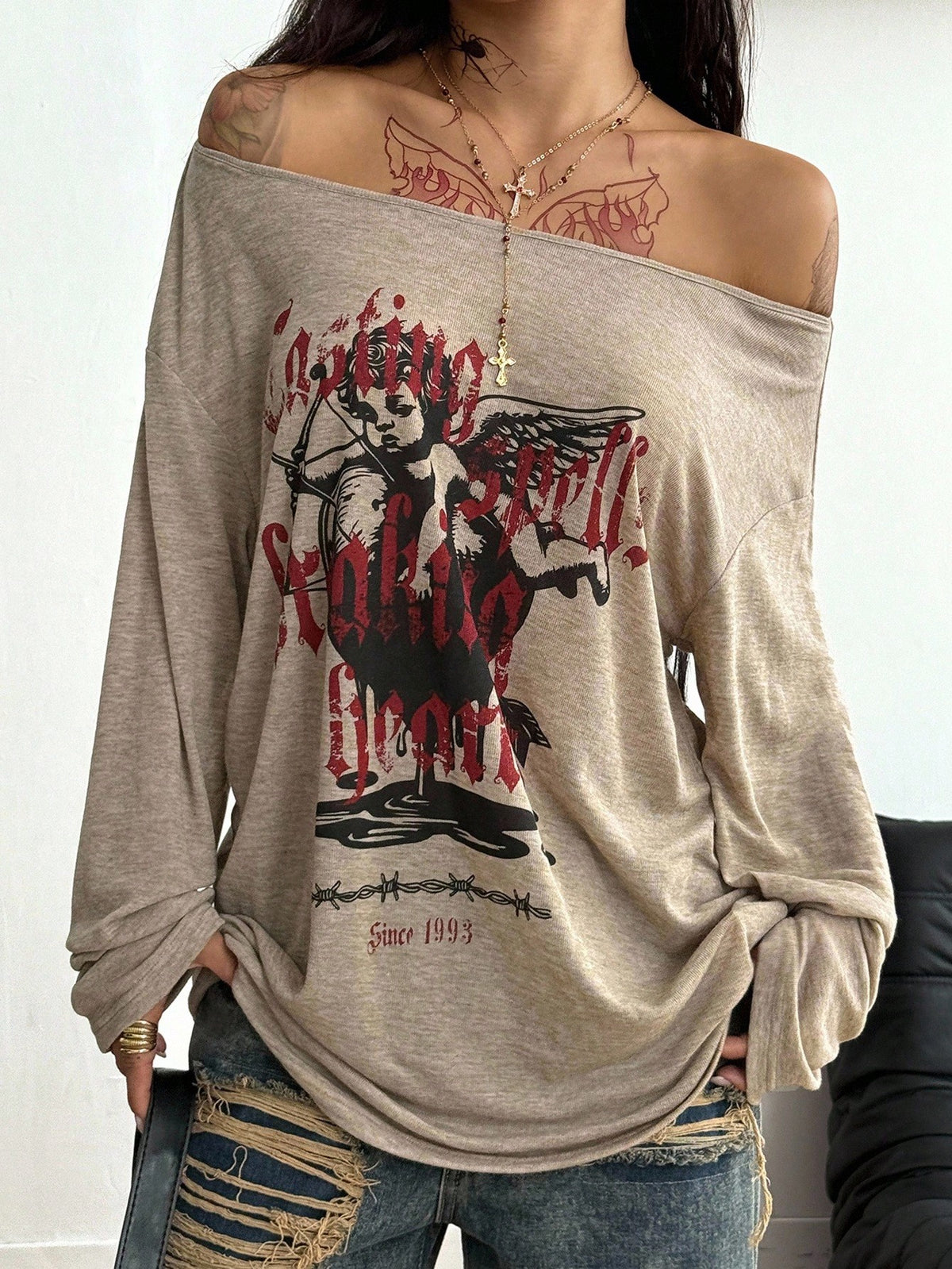 Women's brown striped boat neck long sleeve raglan T-shirt with a loose casual fit
