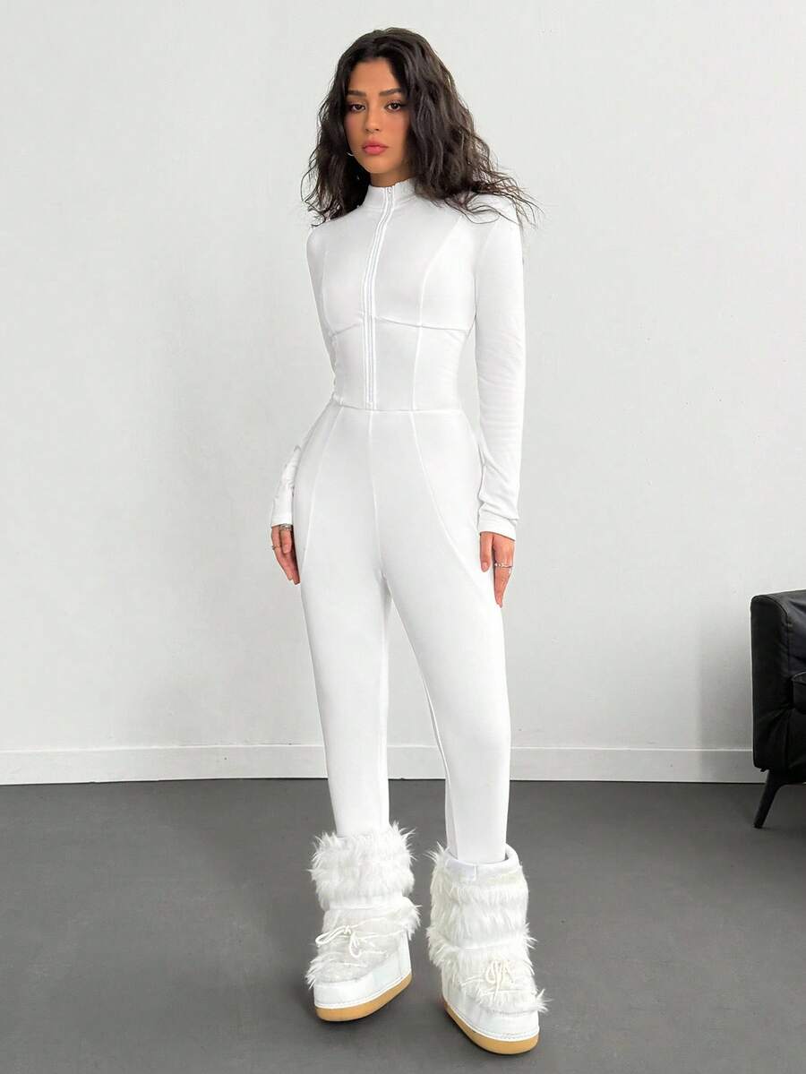 Fitted long sleeve unitard jumpsuit for women featuring a stand collar and front zipper closure in a solid color athletic style.