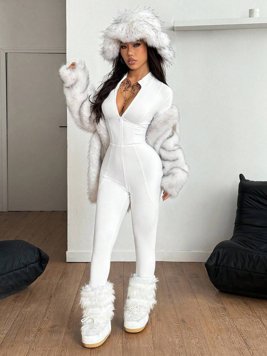 Fitted long sleeve unitard jumpsuit for women featuring a stand collar and front zipper closure in a solid color athletic style.