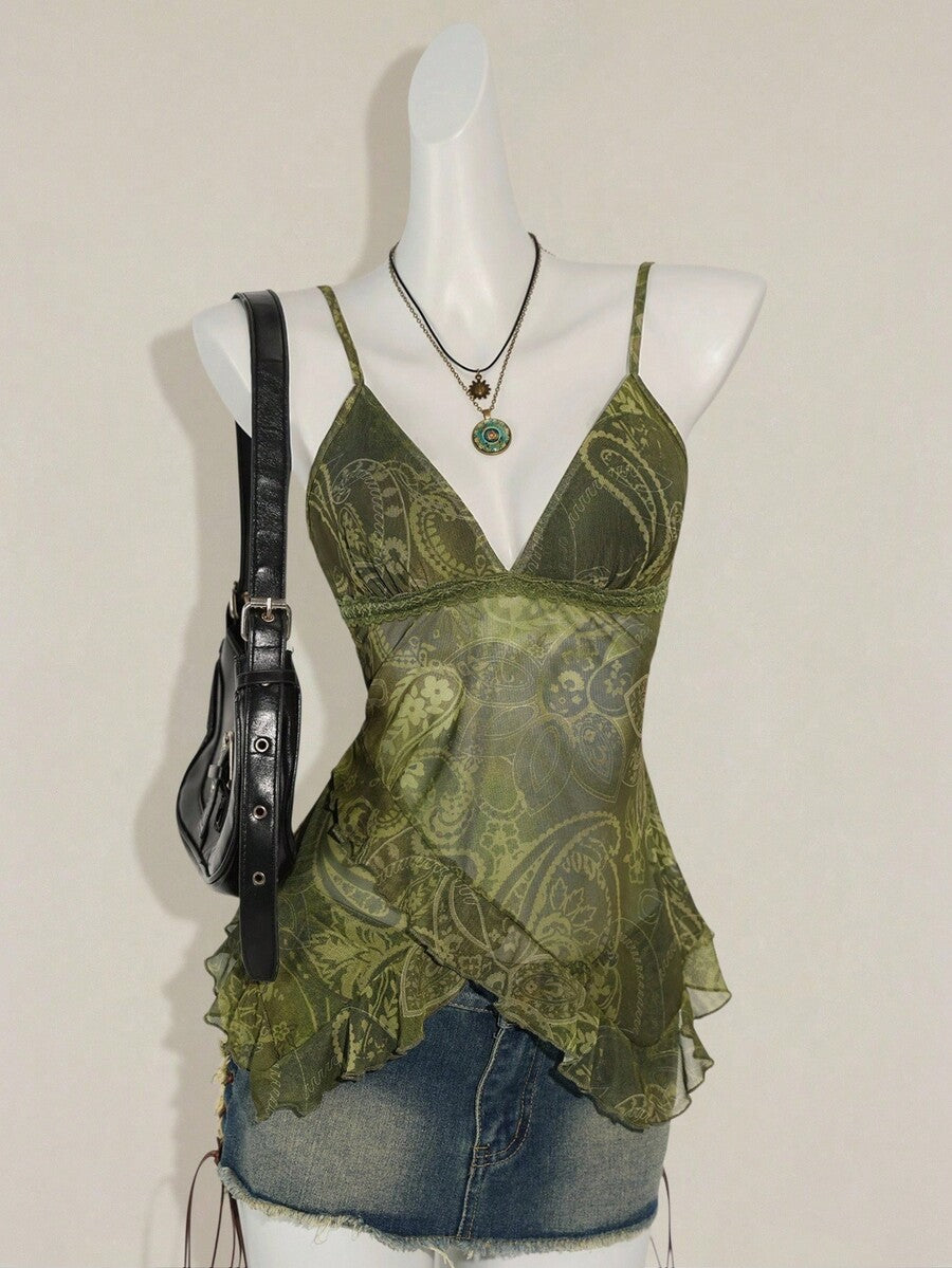 Women's graphic print camisole top featuring thin spaghetti straps, a backless cut, and an asymmetrical hem.