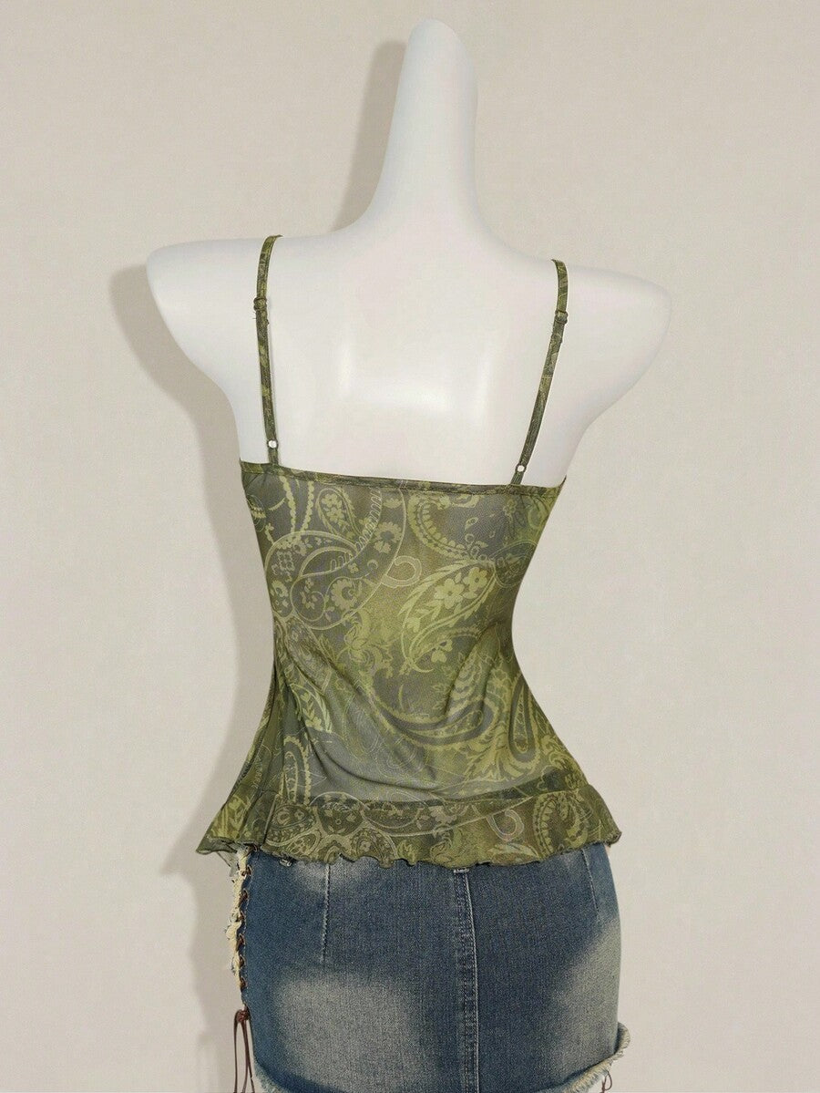 Women's graphic print camisole top featuring thin spaghetti straps, a backless cut, and an asymmetrical hem.