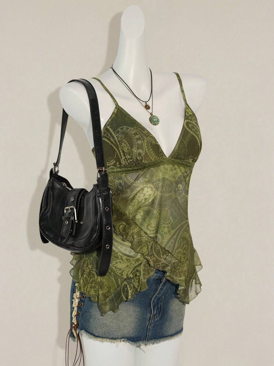 Women's graphic print camisole top featuring thin spaghetti straps, a backless cut, and an asymmetrical hem.