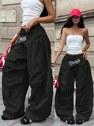 Women's loose fit wide leg parachute pants with elastic drawstring waist and side pockets