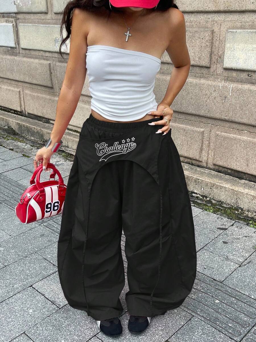 Women's loose fit wide leg parachute pants with elastic drawstring waist and side pockets