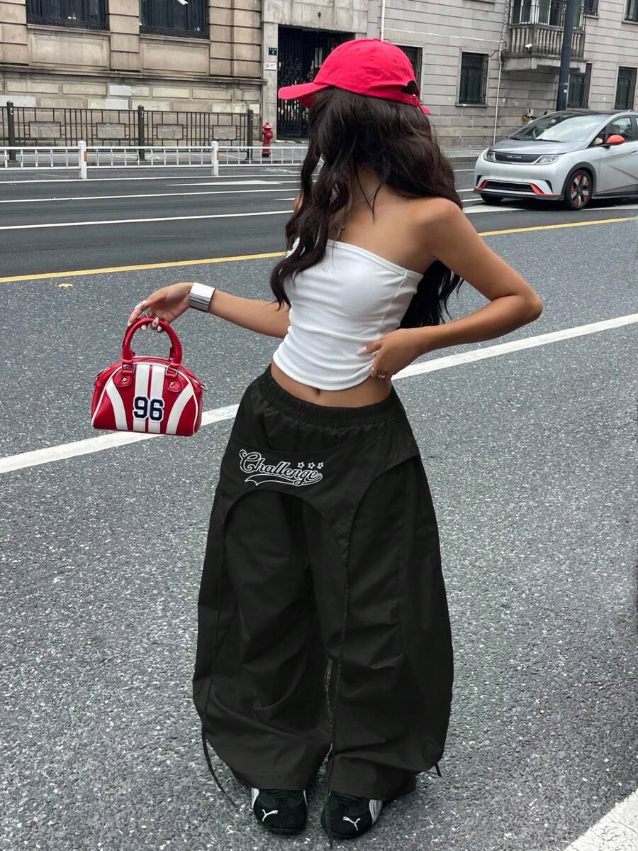 Women's loose fit wide leg parachute pants with elastic drawstring waist and side pockets
