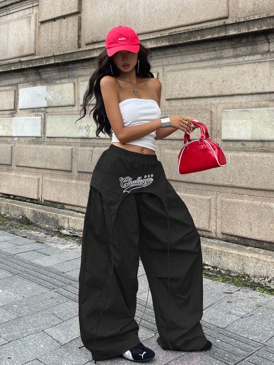 Women's loose fit wide leg parachute pants with elastic drawstring waist and side pockets