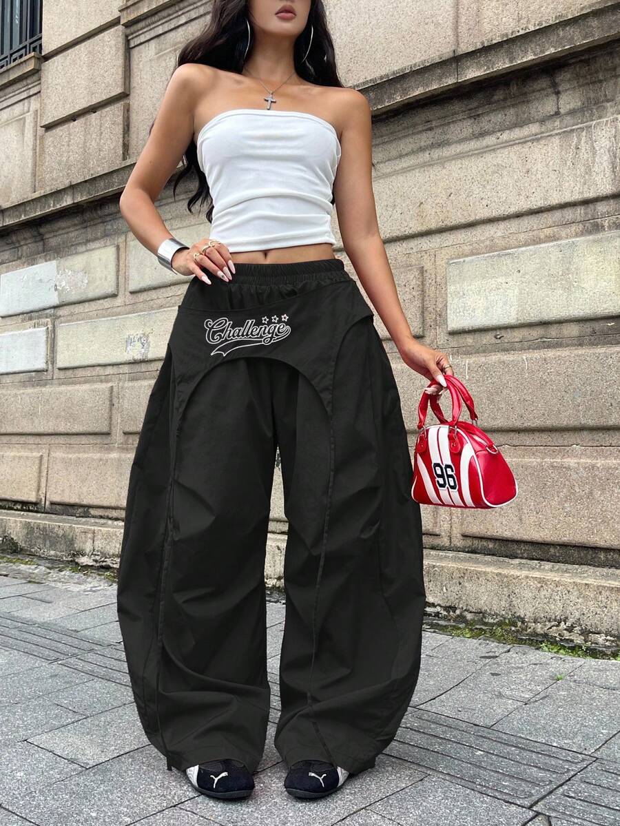 Women's loose fit wide leg parachute pants with elastic drawstring waist and side pockets