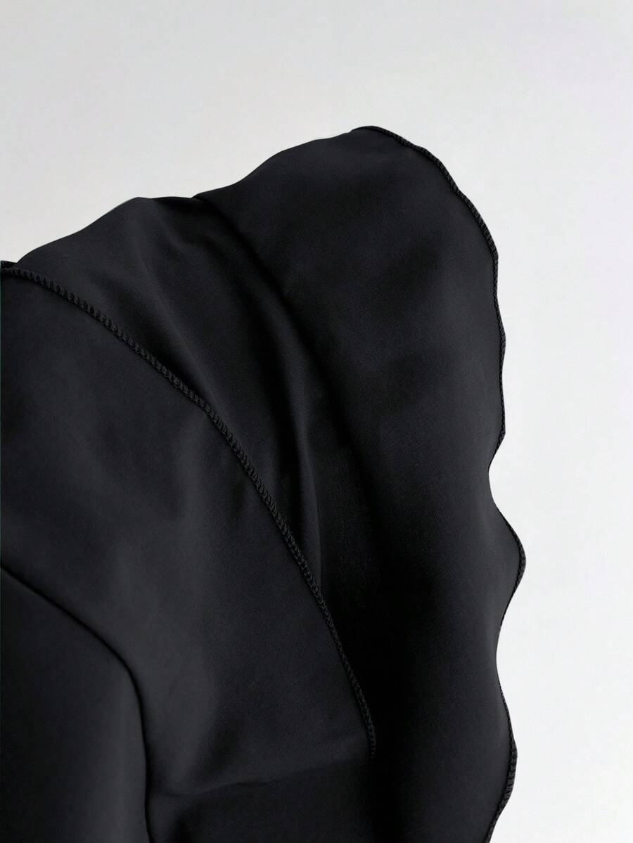 Women's solid color camisole top with thin spaghetti straps, tiered layers, and a flared ruffled hem.
