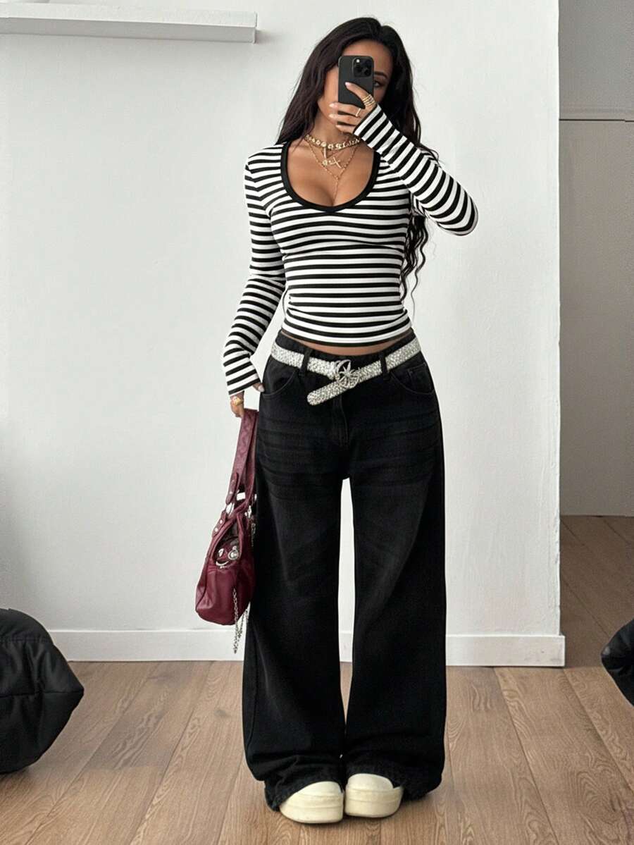 Women's slim fit long sleeve t-shirt with a deep V-neck cut from stretchy knit fabric.