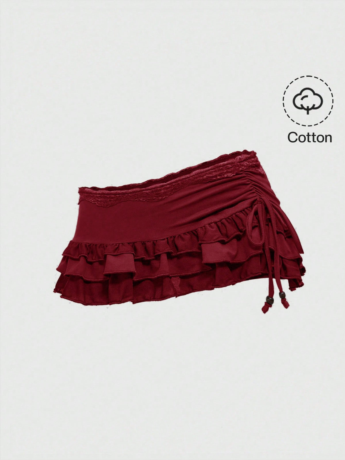 Women's black low-waist mini skirt with drawstring tie, ruched details, lace trim, layered ruffle hem, and asymmetric styling