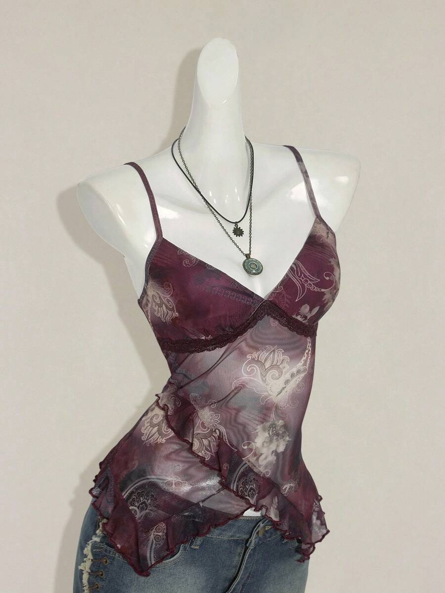 Women's graphic print camisole top featuring thin spaghetti straps, a backless cut, and an asymmetrical hem.