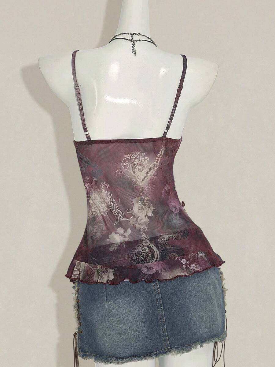 Women's graphic print camisole top featuring thin spaghetti straps, a backless cut, and an asymmetrical hem.