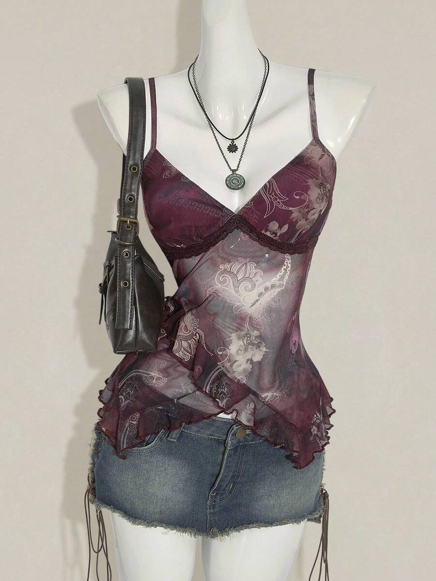 Women's graphic print camisole top featuring thin spaghetti straps, a backless cut, and an asymmetrical hem.