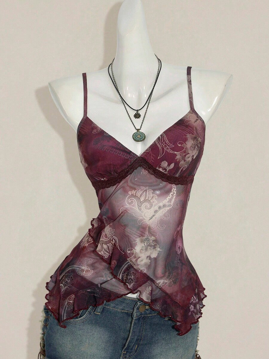 Women's graphic print camisole top featuring thin spaghetti straps, a backless cut, and an asymmetrical hem.