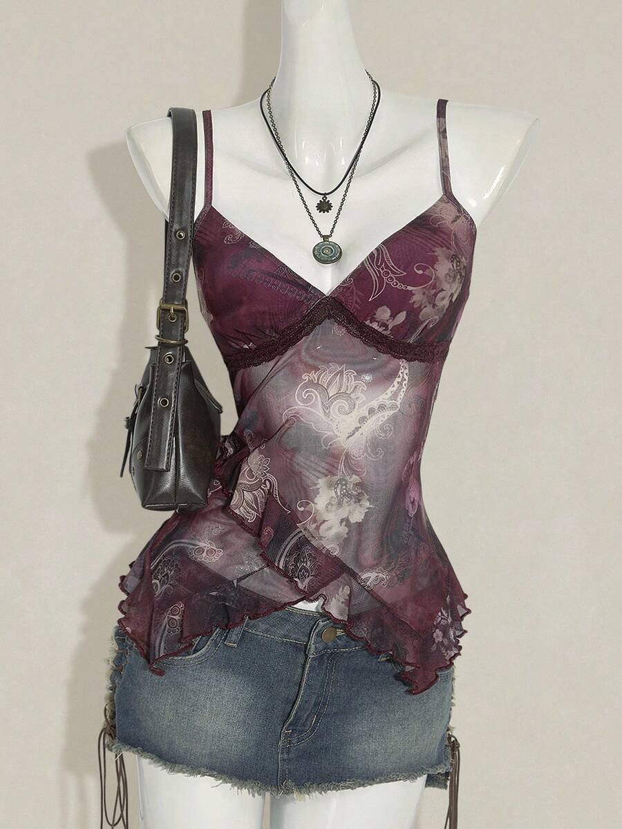 Women's graphic print camisole top featuring thin spaghetti straps, a backless cut, and an asymmetrical hem.