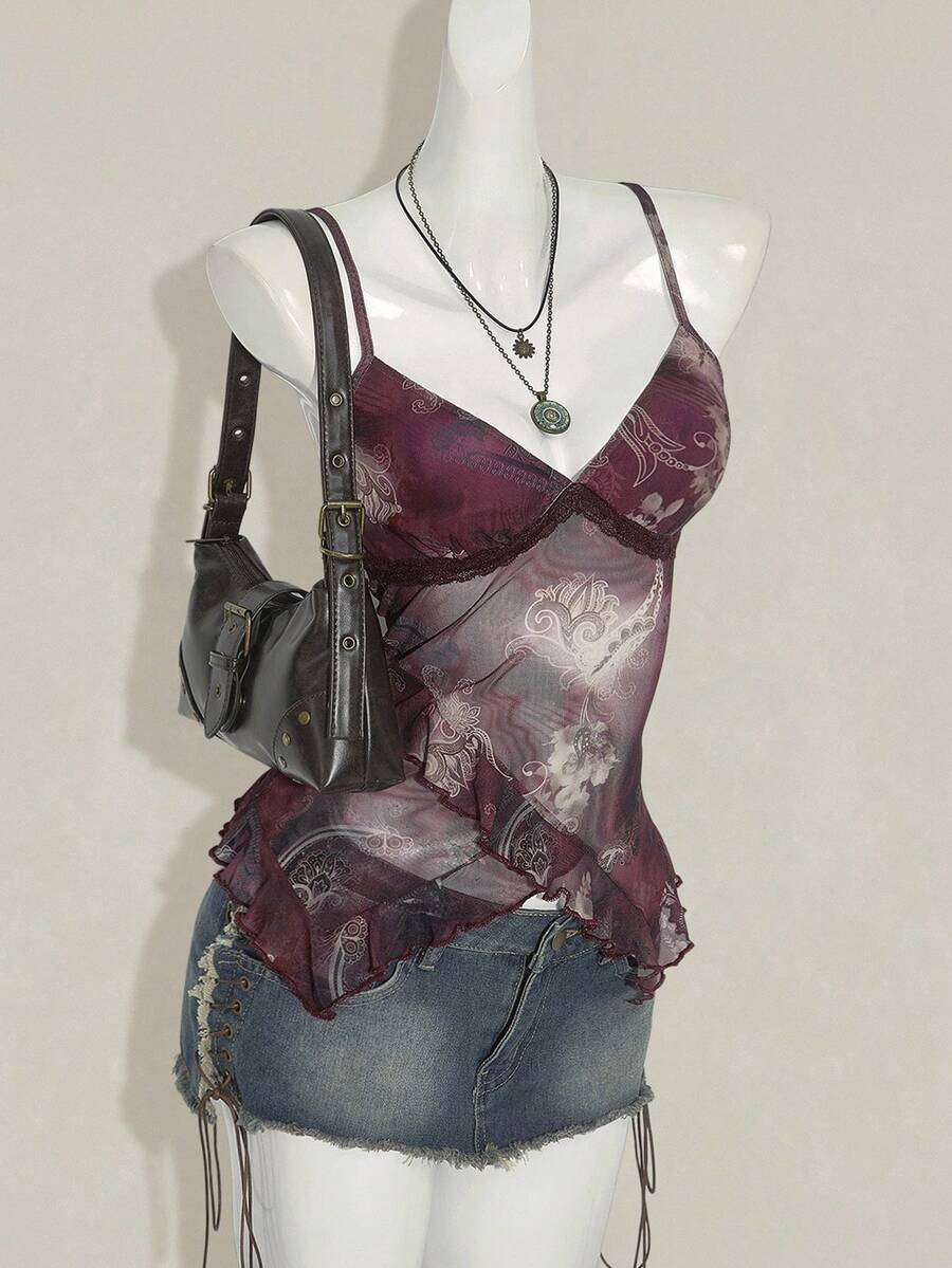 Women's graphic print camisole top featuring thin spaghetti straps, a backless cut, and an asymmetrical hem.