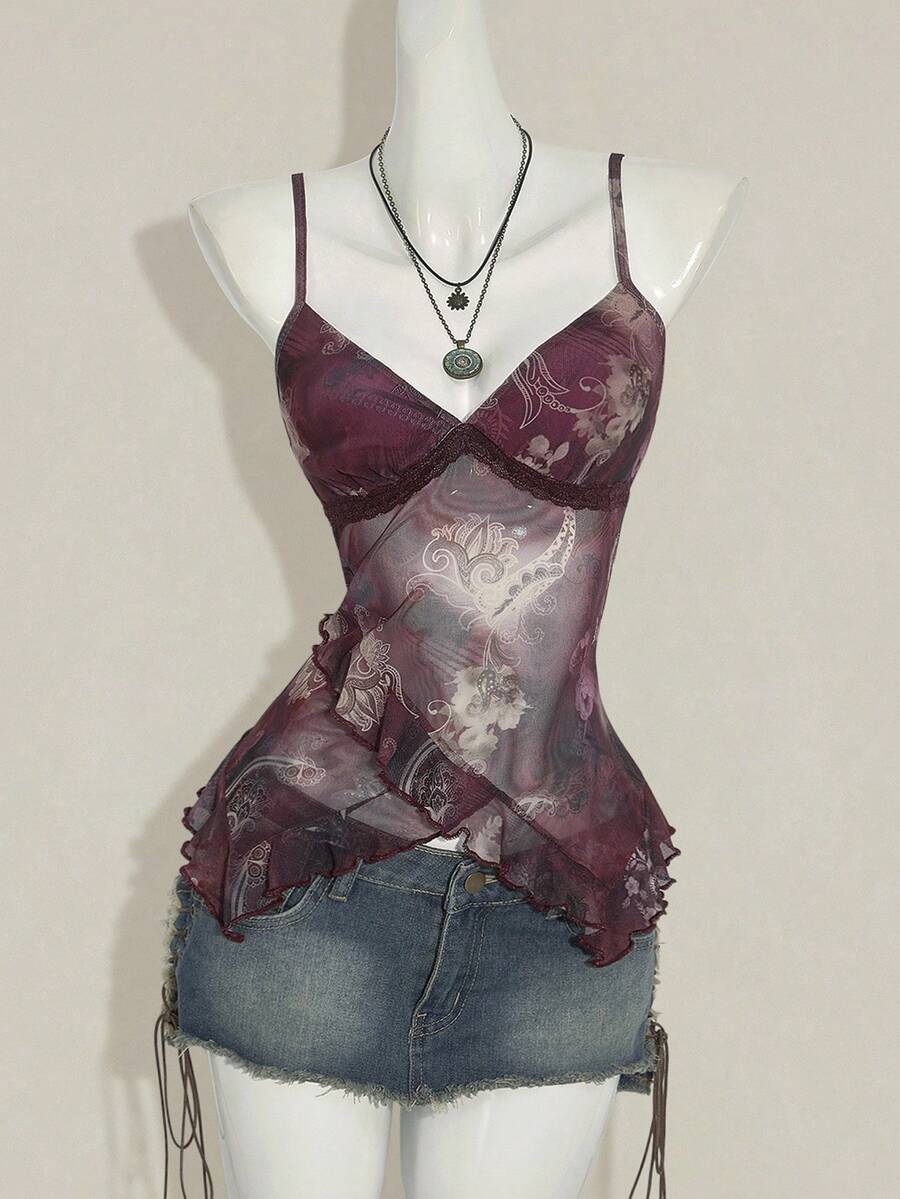 Women's graphic print camisole top featuring thin spaghetti straps, a backless cut, and an asymmetrical hem.