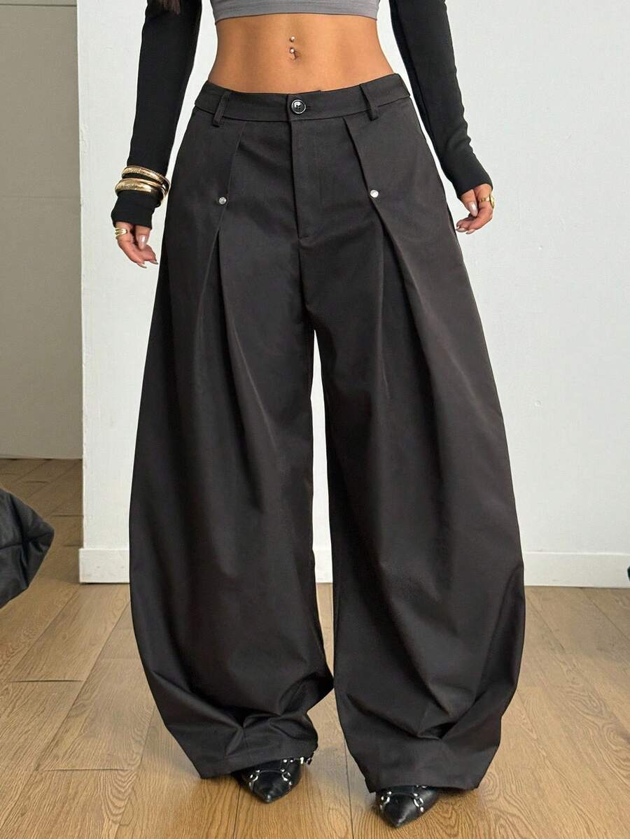 Women's black high-waist wide-leg pants in loose fit woven fabric with button and zipper closure