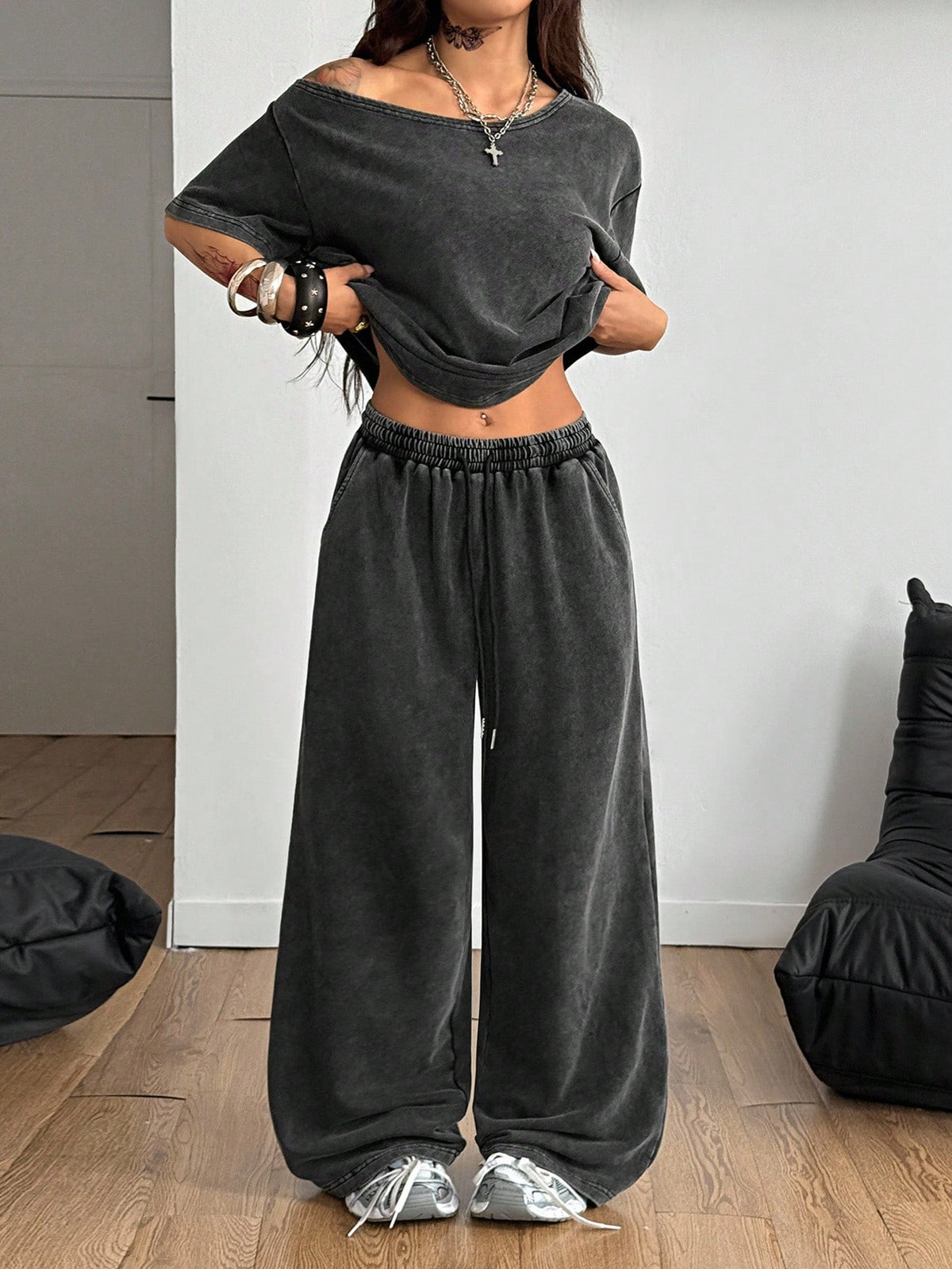 Women's two-piece outfit featuring an oversized asymmetrical neck t-shirt and matching wide-leg drawstring sweatpants.