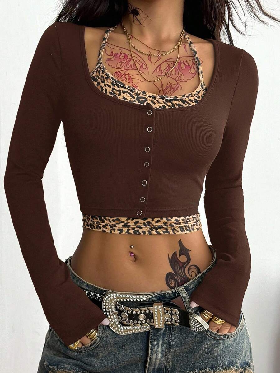 Women's black and white cropped Y2K-style top with lace-up camisole look, halter neckline, long sleeves, button front, rib-knit texture, and slim fit