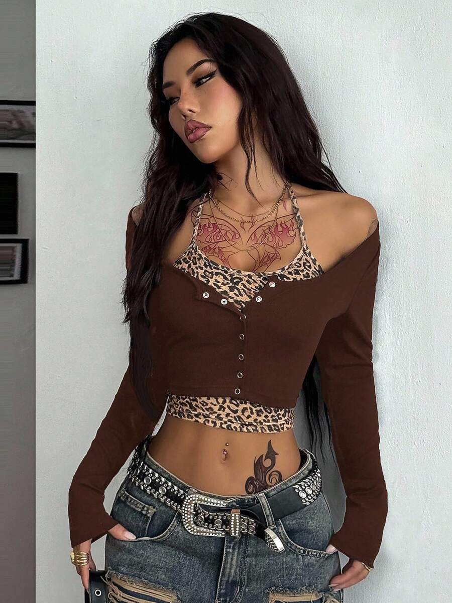 Women's black and white cropped Y2K-style top with lace-up camisole look, halter neckline, long sleeves, button front, rib-knit texture, and slim fit