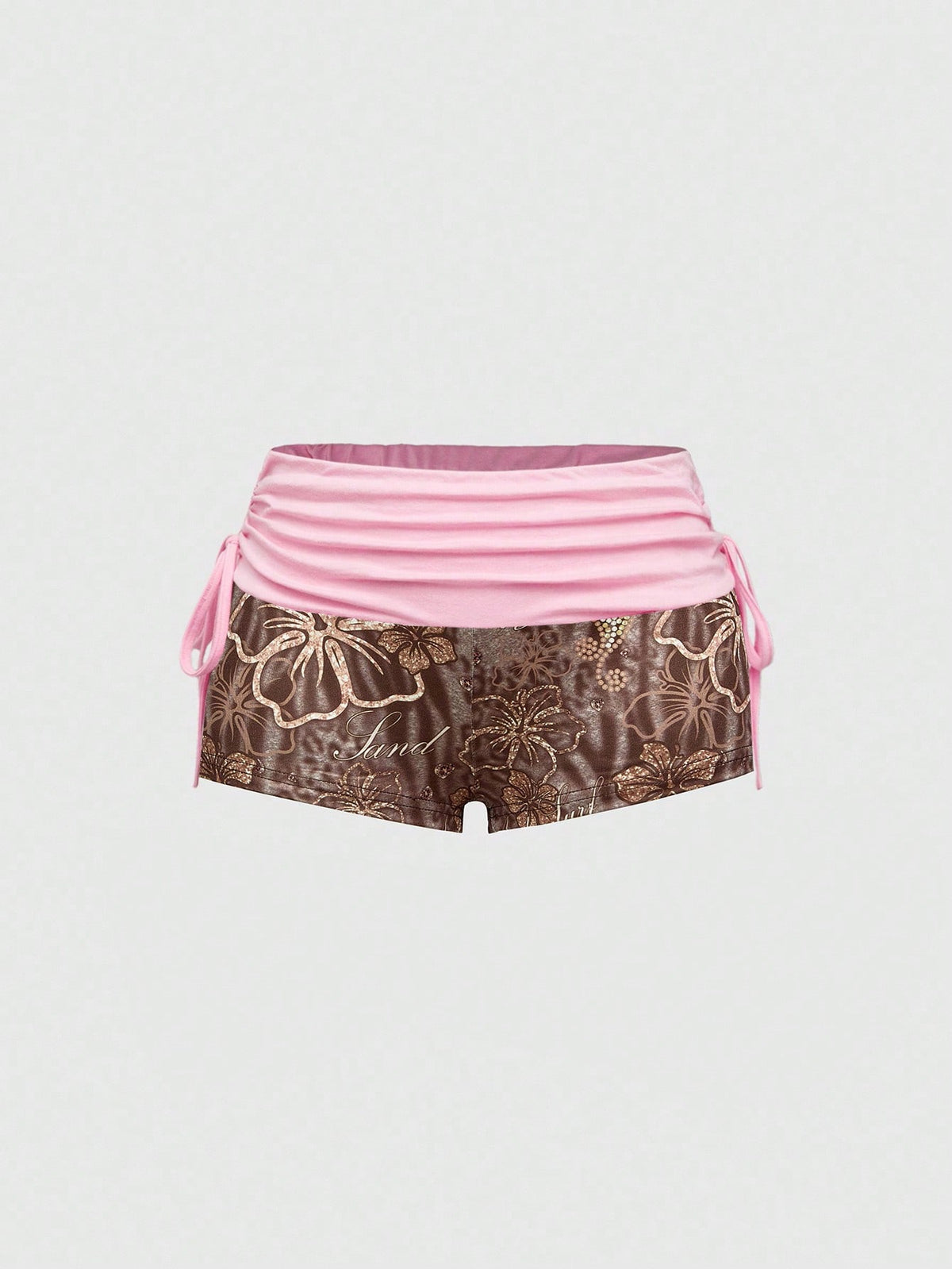 Women's low waist mini track shorts with elastic waistband, drawstring knot, ruched details, and plant pattern in a Y2K boho style