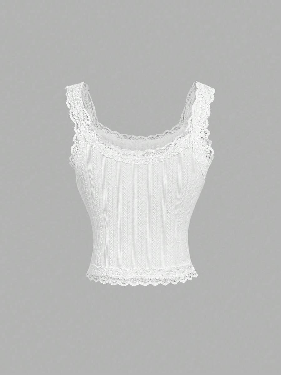 Black jacquard textured camisole top featuring contrast lace trim, bow decoration, scoop neck, and wide shoulder straps.
