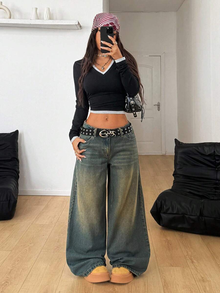 Women's loose wide-leg jeans in light wash denim with low waist and extra-long relaxed fit