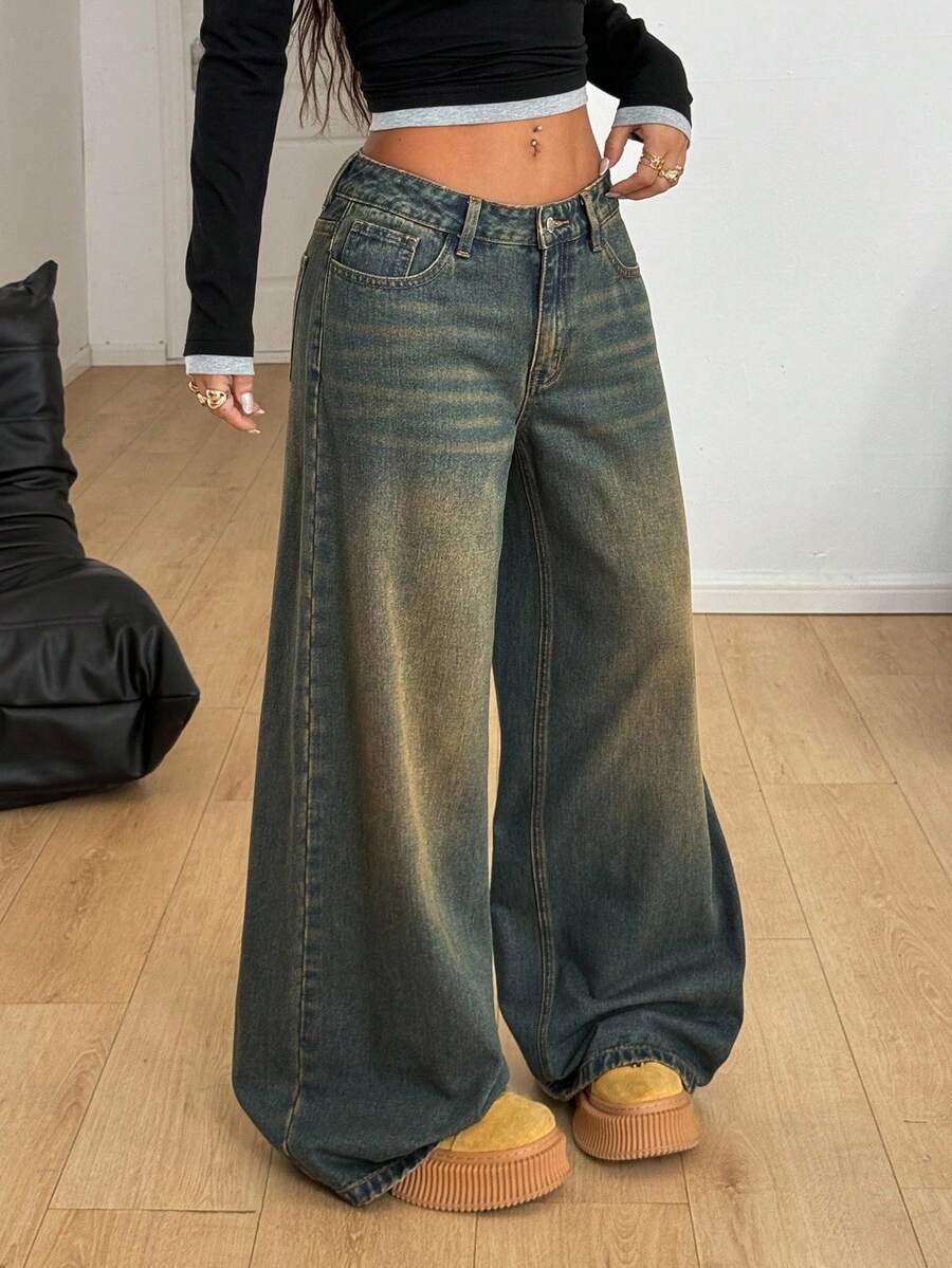 Women's loose wide-leg jeans in light wash denim with low waist and extra-long relaxed fit