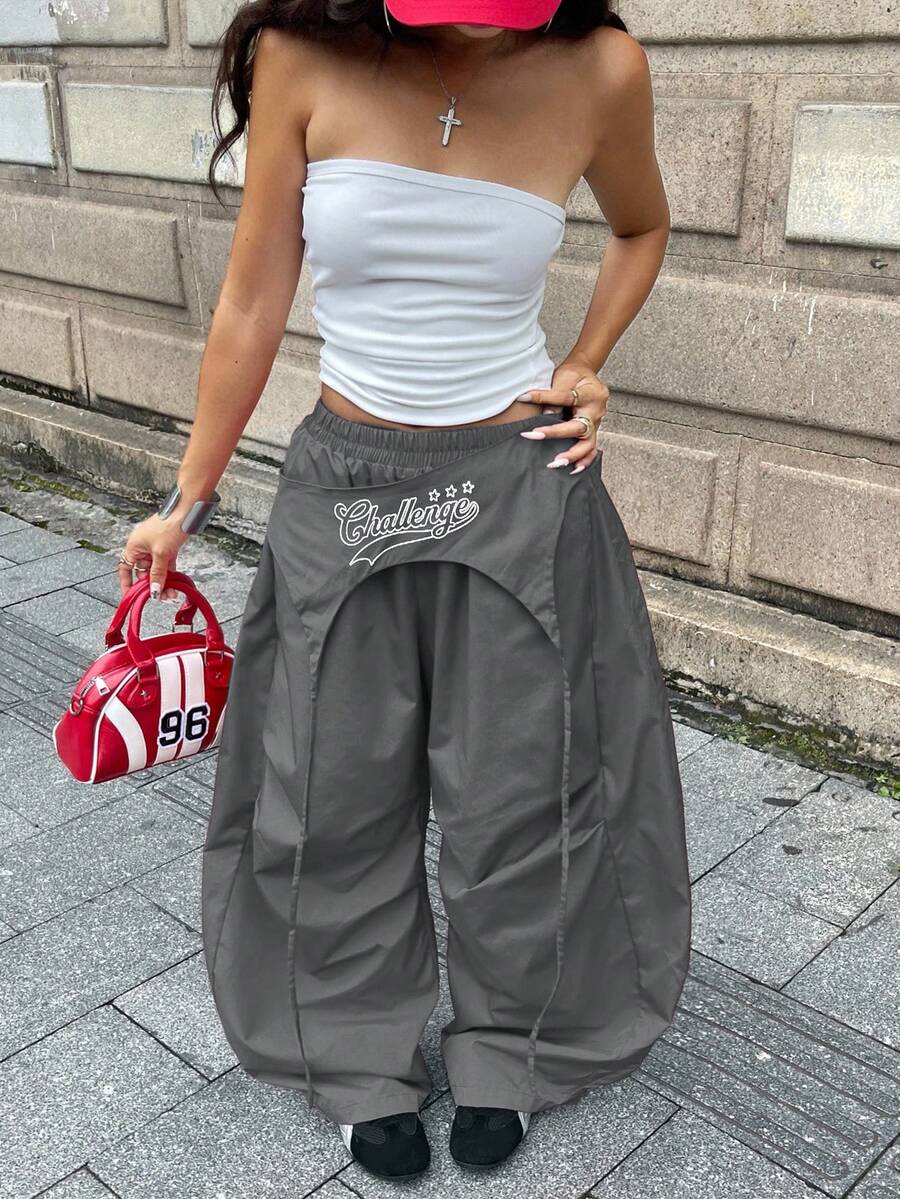 Women's loose fit wide leg parachute pants with elastic drawstring waist and side pockets