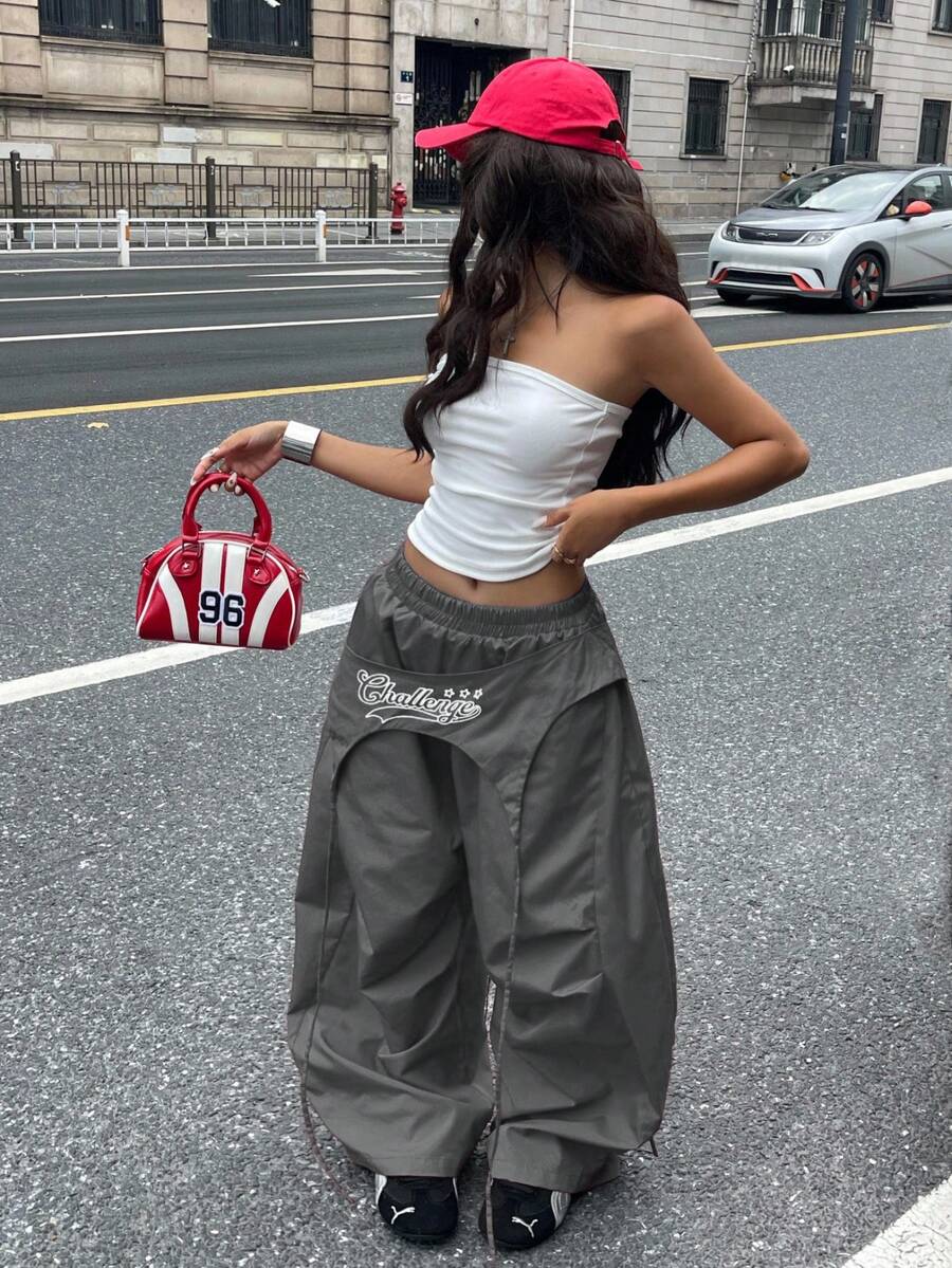 Women's loose fit wide leg parachute pants with elastic drawstring waist and side pockets