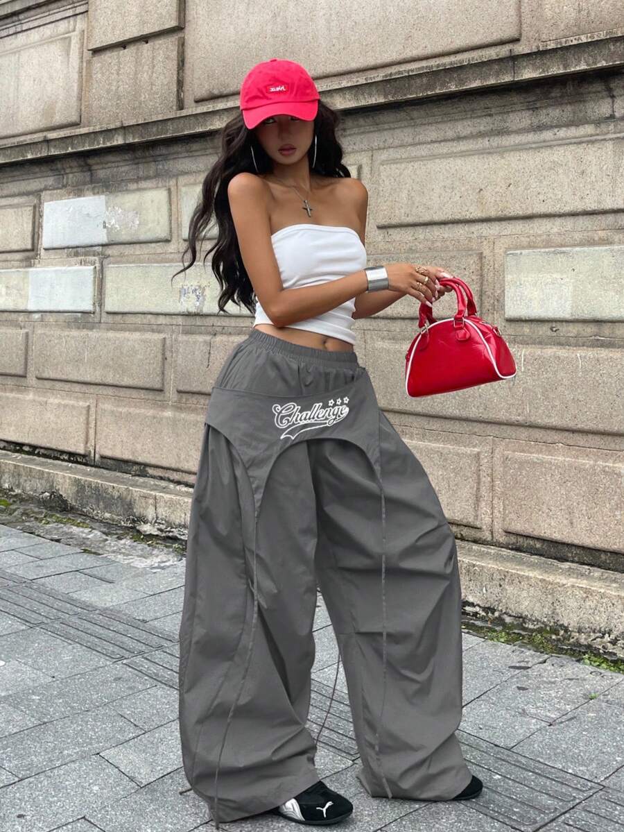 Women's loose fit wide leg parachute pants with elastic drawstring waist and side pockets