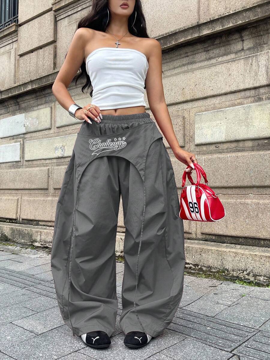 Women's loose fit wide leg parachute pants with elastic drawstring waist and side pockets