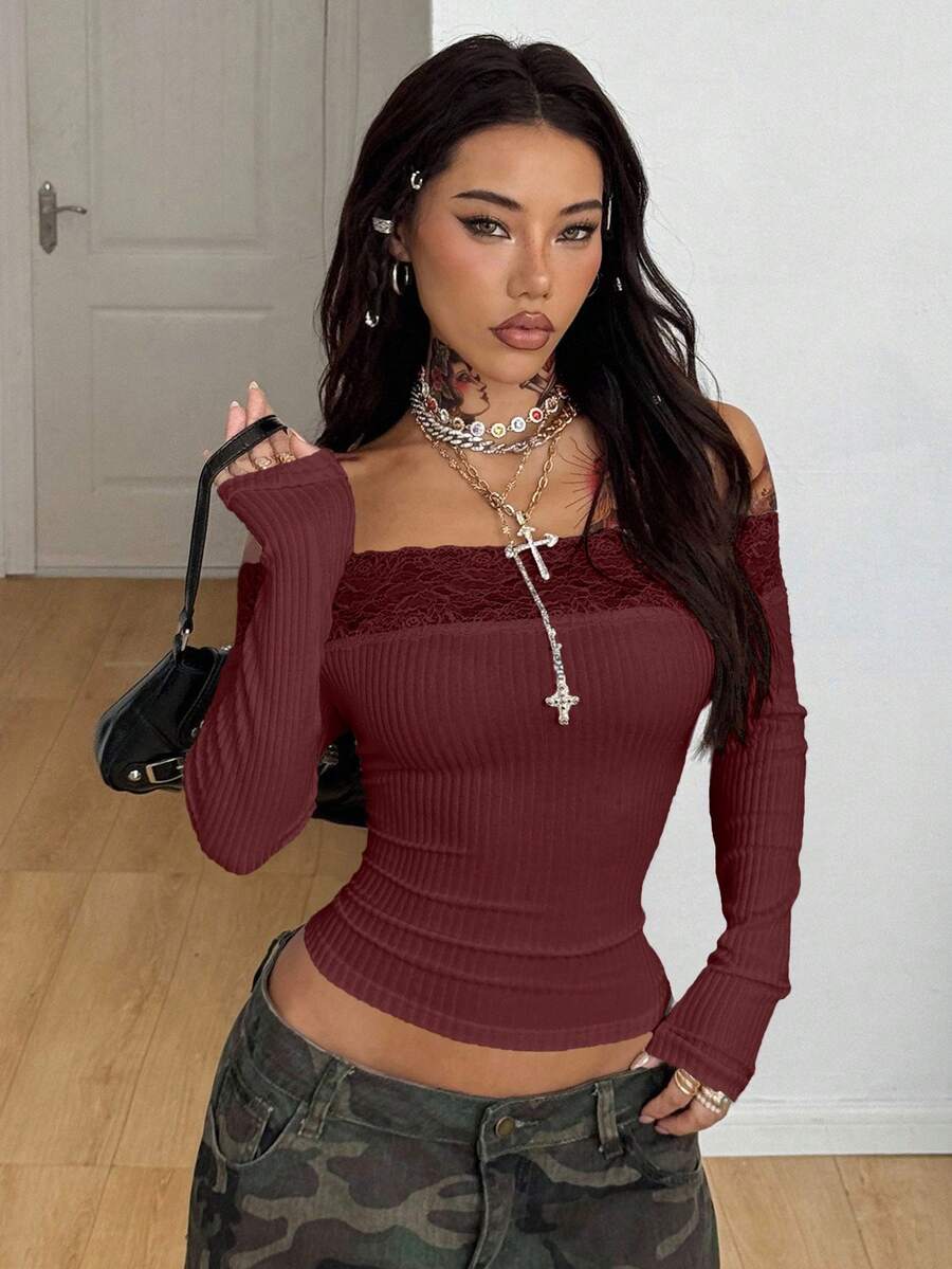 Women's slim fit off the shoulder long sleeve knitted top featuring contrast lace trim and ruched accents.