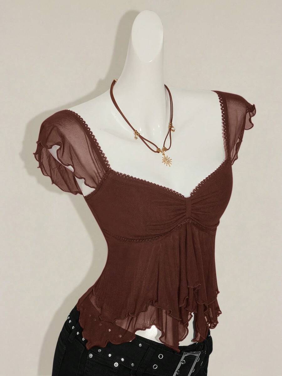 Black slim fit women's ruched front camisole tank top featuring contrast mesh inserts, square neckline, and an asymmetrical crop hem.