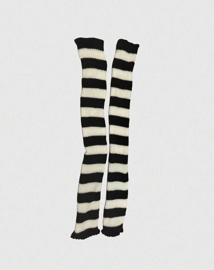 Pair of women's extra long knitted leg warmers featuring a gothic grunge design with subtle ruffle detailing.