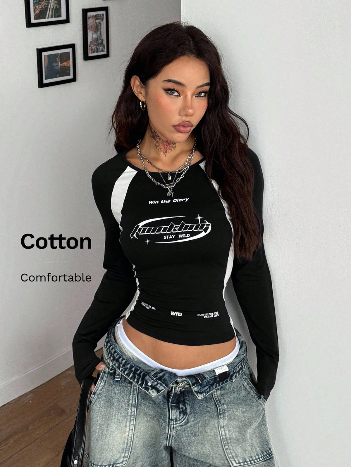 Women's slim fit long sleeve raglan t-shirt with collegiate letter graphic print, round neck, and contrast binding.