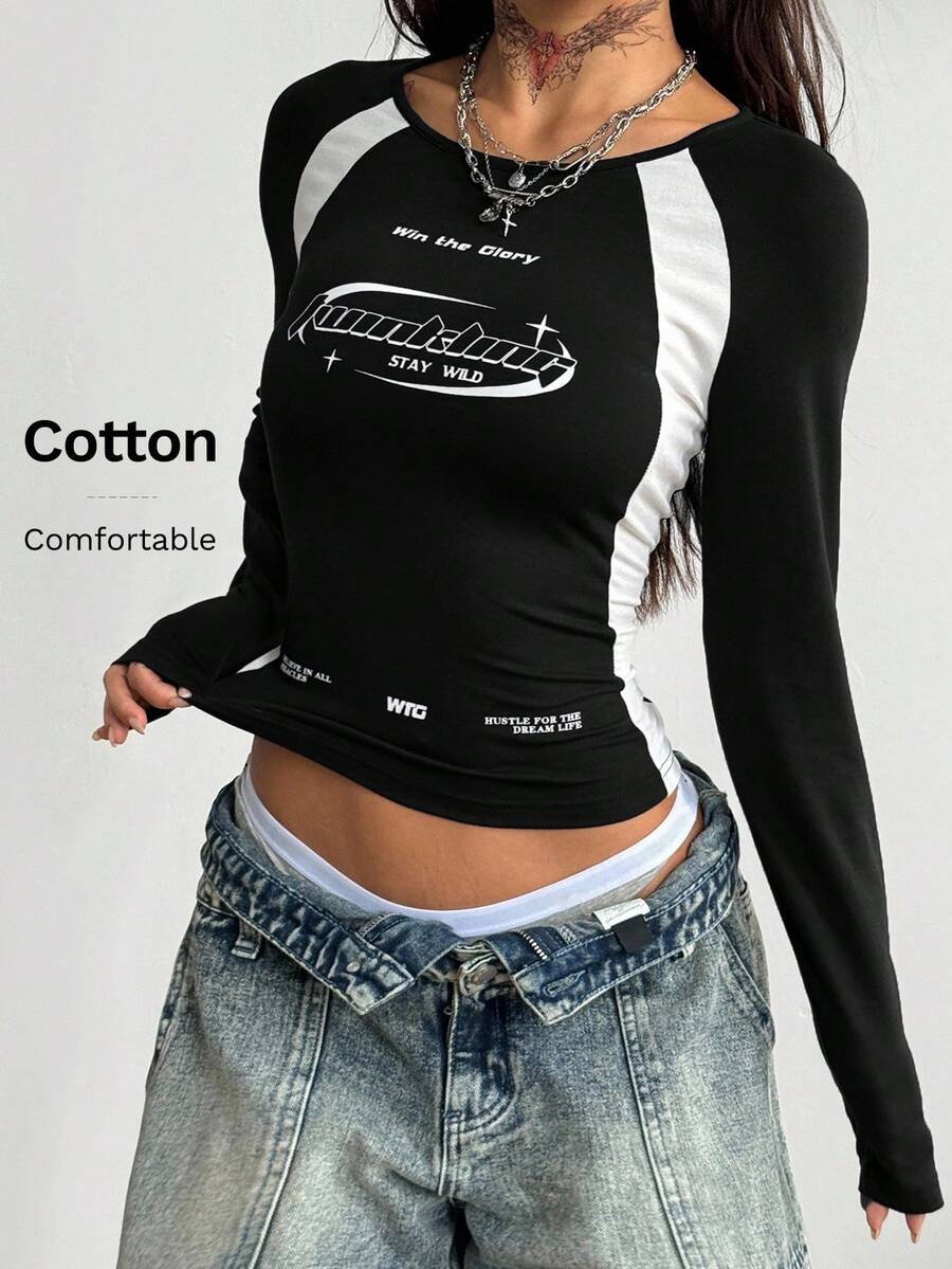 Women's slim fit long sleeve raglan t-shirt with collegiate letter graphic print, round neck, and contrast binding.