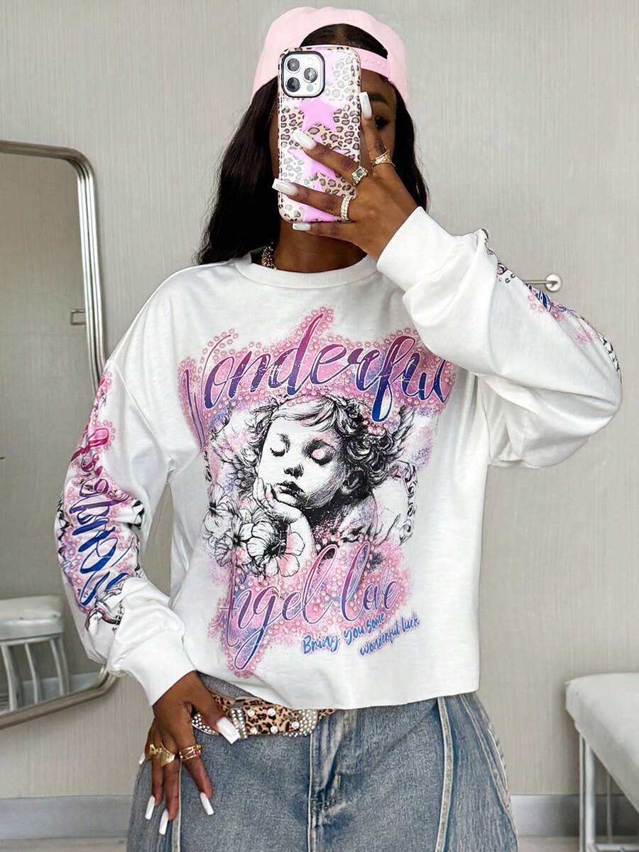 Women's white oversized long sleeve graphic T-shirt with drop shoulders and a round neckline.