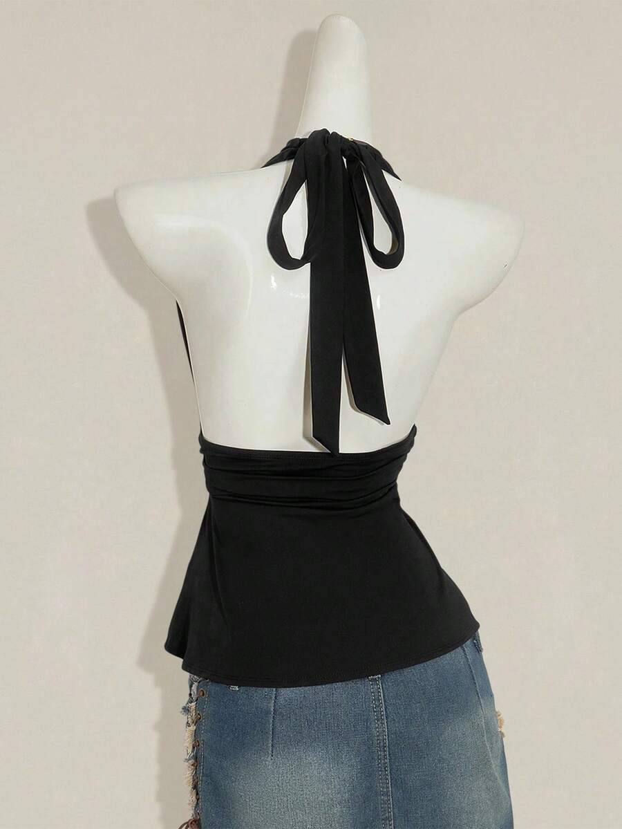 Women's backless halter babydoll tank top featuring a square neckline, slim fit silhouette, and a flared ruffle hem.