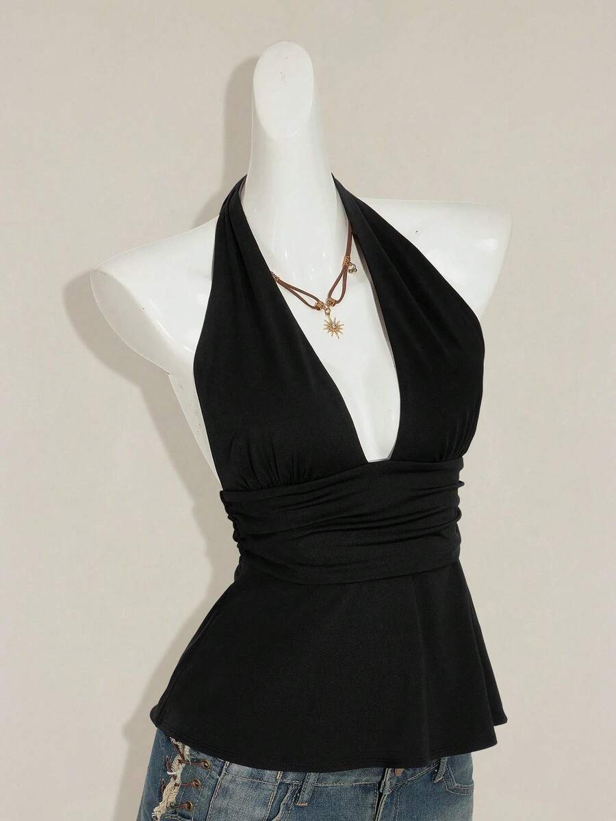 Women's backless halter babydoll tank top featuring a square neckline, slim fit silhouette, and a flared ruffle hem.