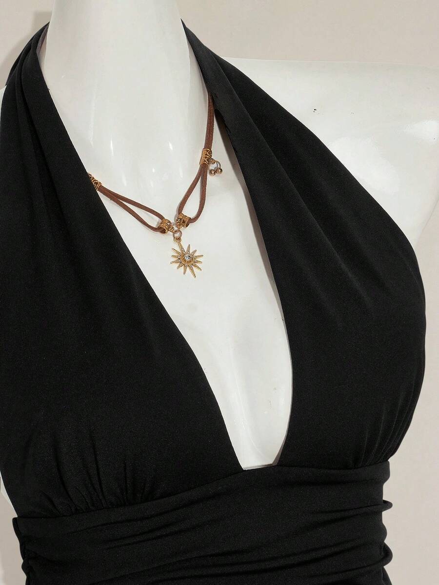 Women's backless halter babydoll tank top featuring a square neckline, slim fit silhouette, and a flared ruffle hem.