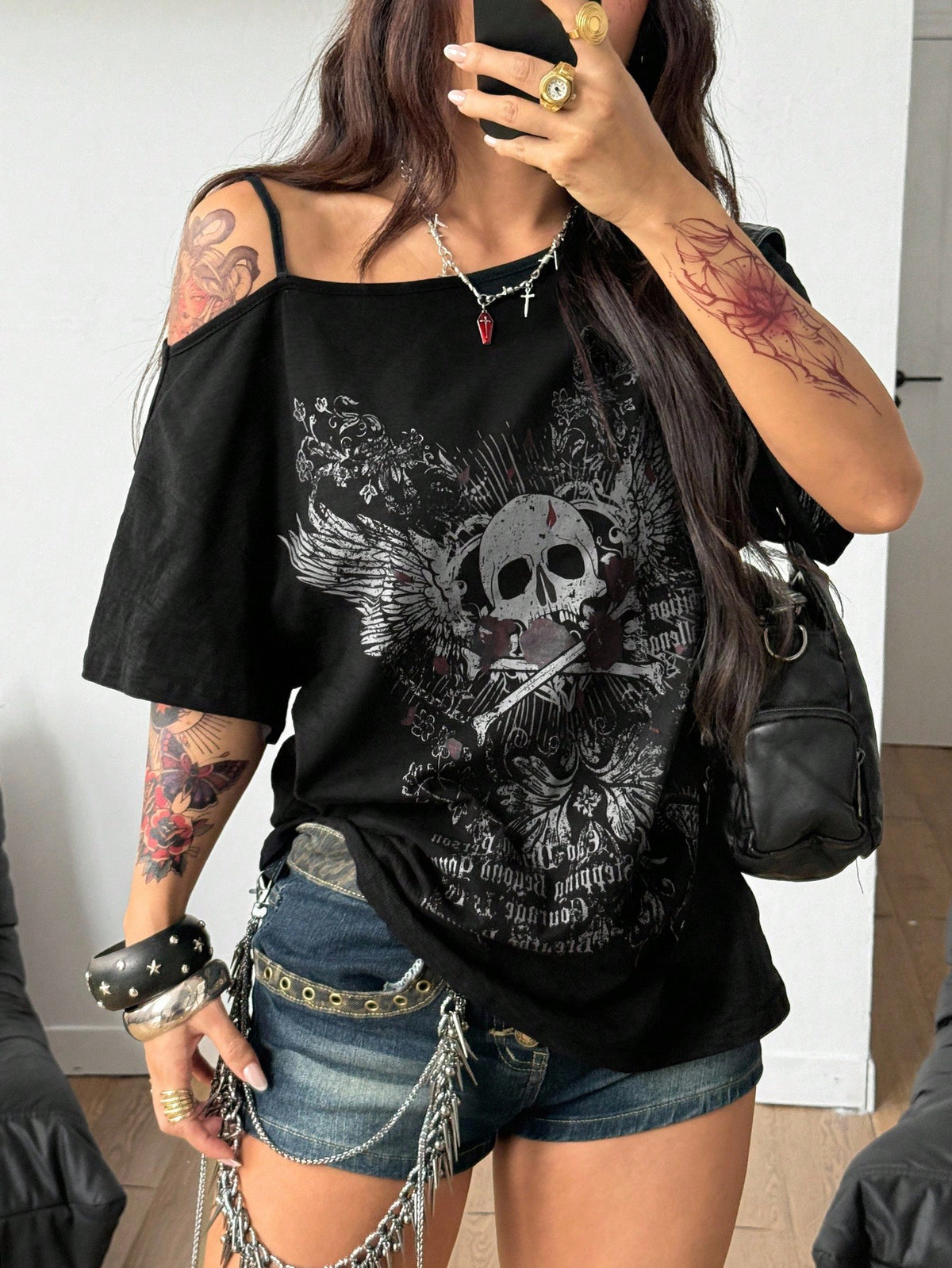 Women's casual loose fit cold shoulder cotton t-shirt with asymmetrical cutout neckline and short sleeves.